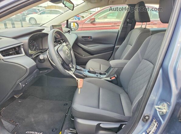 JTDB4MEE8PJ010711 2023 TOYOTA COROLLA Серый Вид салона спереди