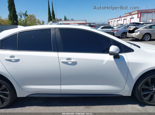 JTDBCMFE0PJ015001 2023 TOYOTA COROLLA White Vista interior trasera