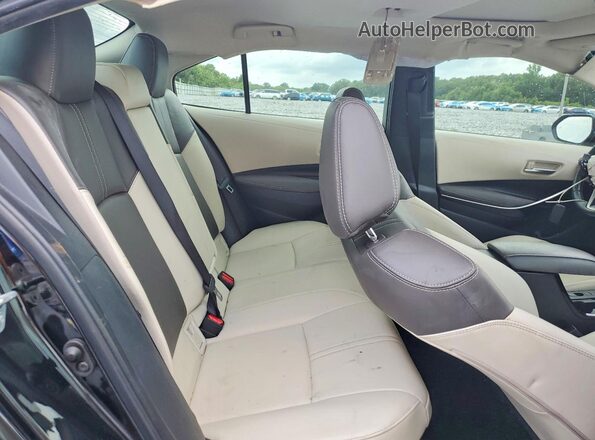 JTDBCMFE3R3043091 2024 TOYOTA COROLLA Black Rear seats view