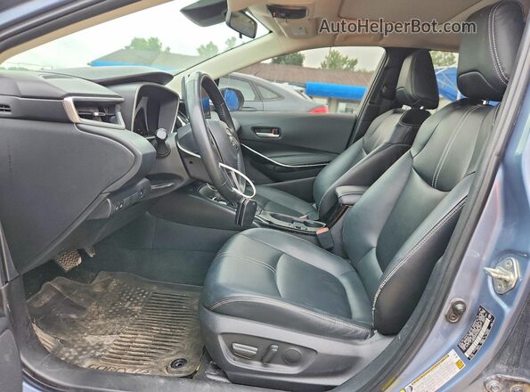 JTDBCMFE7R3036631 2024 TOYOTA COROLLA Синий Вид салона спереди