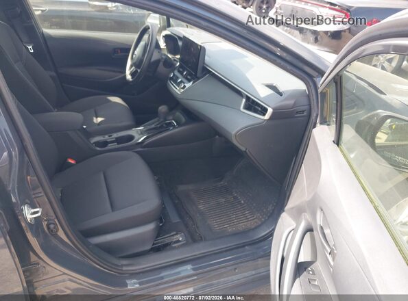 JTDBDMHE7P3006777 2023 TOYOTA COROLLA Серый Вид салона спереди