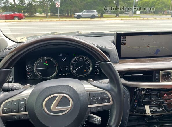 JTJDY7AX6M4337282 2021 LEXUS LX Gray Vista interior delantera