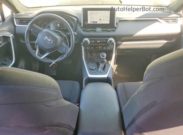JTM16RFV6PD102044 2023 TOYOTA RAV4 White Dashboard view