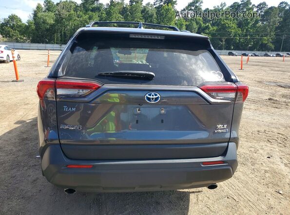 JTMB6RFV7PD106348 2023 TOYOTA RAV4 Gray Widok z tyłu