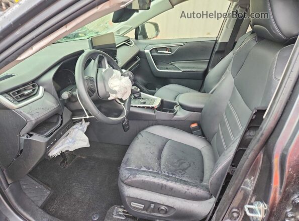 JTMB6RFV7RD127509 2024 TOYOTA RAV4 Charcoal Front interior view