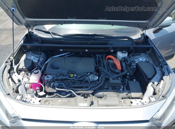 JTMB6RFV7RD143886 2024 TOYOTA RAV4 HYBRID Silver Вид ззаду