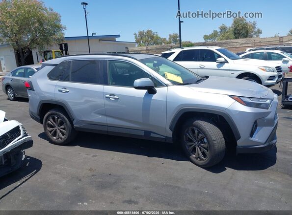 JTMB6RFV7RD143886 2024 TOYOTA RAV4 HYBRID Silver Вид задньої частини салону