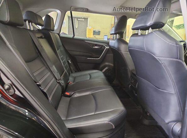 JTMB6RFV9PD087012 2023 TOYOTA RAV4 Черный Вид задней части салона