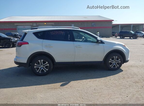JTMBFREV1GJ065122 2016 TOYOTA RAV4 Белый Вид задней части салона