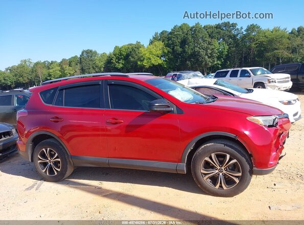 JTMBFREV1GJ096614 2016 TOYOTA RAV4 Красный Вид задней части салона