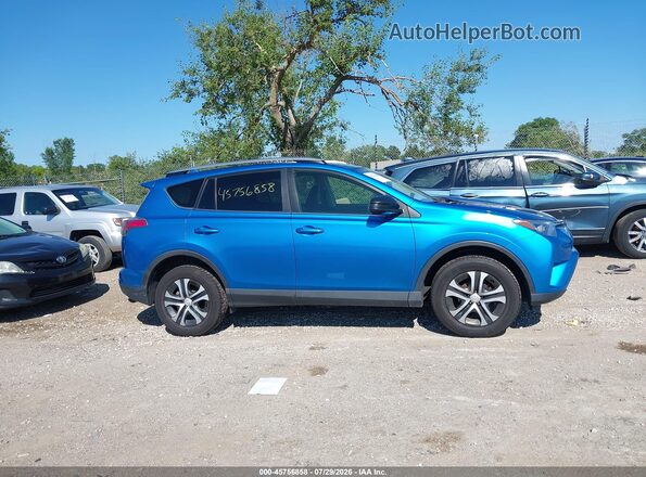 JTMBFREV2HJ702925 2017 TOYOTA RAV4 Blue Rear interior view