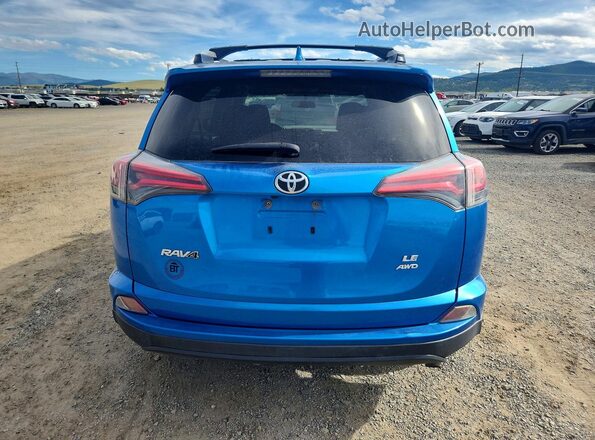 JTMBFREV4GJ091259 2016 TOYOTA RAV4 Blue Rear view