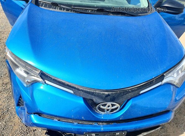 JTMBFREV4GJ091259 2016 TOYOTA RAV4 Blue Rear interior view