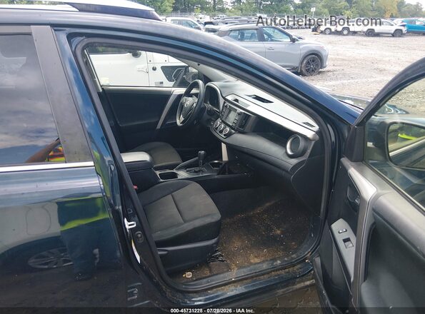 JTMBFREV4HJ710489 2017 TOYOTA RAV4 Blue Front interior view
