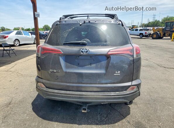 JTMBFREV5HJ709609 2017 TOYOTA RAV4 Gray Rear view