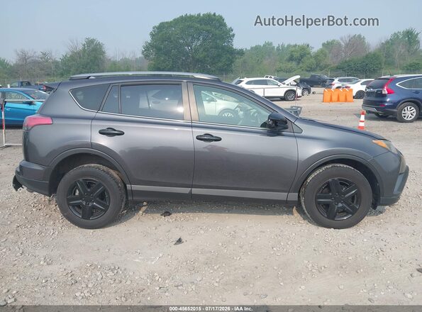 JTMBFREV6HJ715564 2017 TOYOTA RAV4 Серый Вид задней части салона