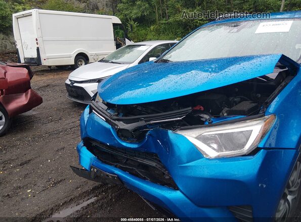 JTMBFREV6JJ215068 2018 TOYOTA RAV4 Blue Front view