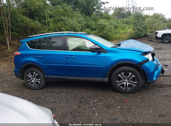 JTMBFREV6JJ215068 2018 TOYOTA RAV4 Blue Rear interior view