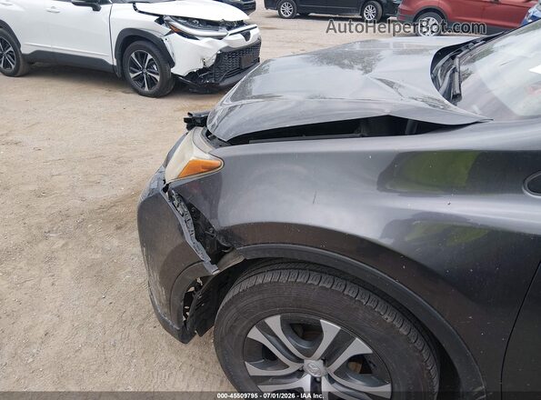 JTMBFREV7JJ727597 2018 TOYOTA RAV4 Gray Front view