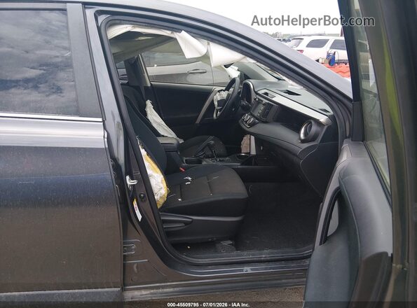 JTMBFREV7JJ727597 2018 TOYOTA RAV4 Gray Front interior view