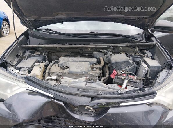 JTMBFREV7JJ727597 2018 TOYOTA RAV4 Gray Rear view