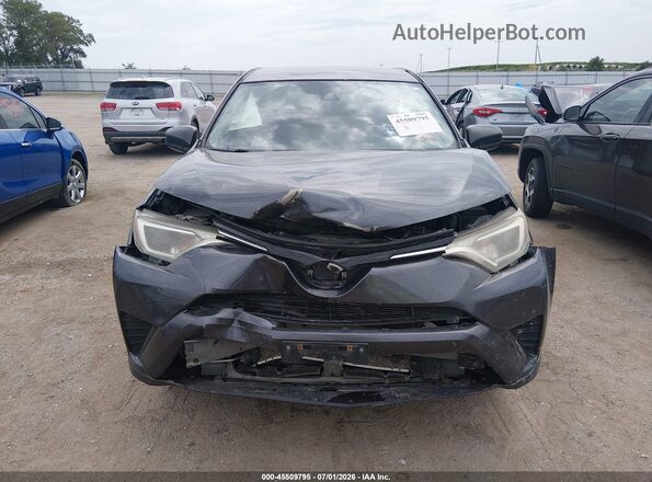 JTMBFREV7JJ727597 2018 TOYOTA RAV4 Gray Rear interior view