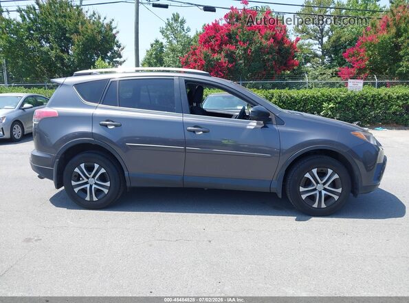 JTMBFREV8JJ730833 2018 TOYOTA RAV4 Gray Rear interior view