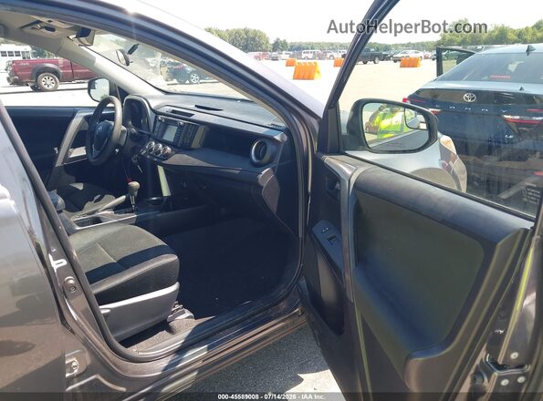 JTMBFREV9GJ086042 2016 TOYOTA RAV4 Gray Vista interior delantera