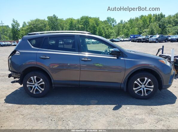 JTMBFREV9HJ140652 2017 TOYOTA RAV4 Gray Rear interior view