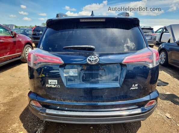 JTMBFREV9JJ735829 2018 TOYOTA RAV4 Blue Rear view