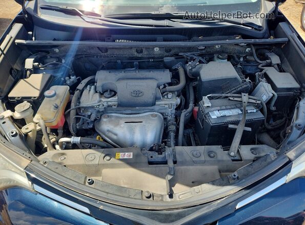JTMBFREV9JJ735829 2018 TOYOTA RAV4 Blue Rear interior view