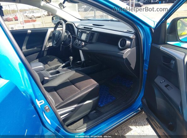 JTMBFREVXJJ734138 2018 TOYOTA RAV4 Blue Front interior view