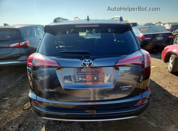 JTMDFREV1JJ735025 2018 TOYOTA RAV4 Gray Vista trasera