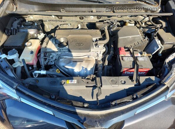 JTMDFREV1JJ735025 2018 TOYOTA RAV4 Gray Vista interior trasera