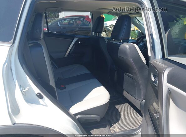 JTMDFREV3JJ214808 2018 TOYOTA RAV4 White Вид наклейки з VIN-кодом