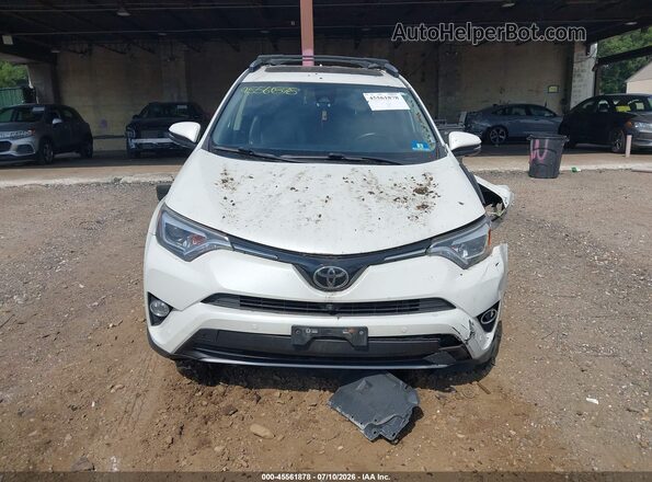 JTMDFREV4HJ711926 2017 TOYOTA RAV4 White Vista interior trasera
