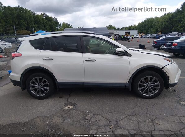 JTMDFREV5JJ222747 2018 TOYOTA RAV4 White Vista interior trasera