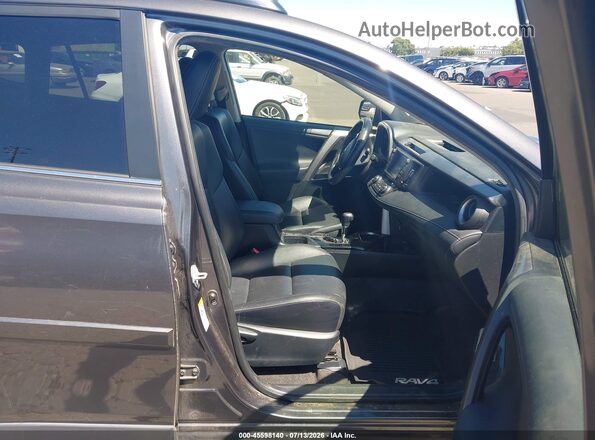 JTMDFREV8GJ077373 2016 TOYOTA RAV4 Gray Widok wnętrza z przodu