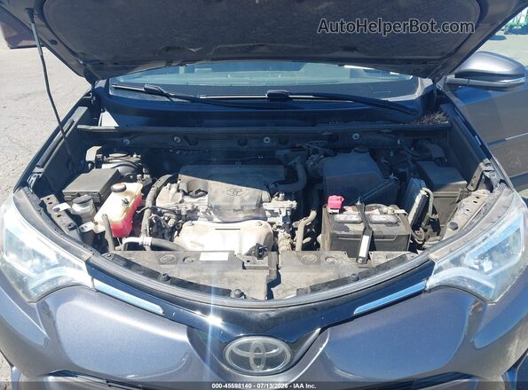 JTMDFREV8GJ077373 2016 TOYOTA RAV4 Gray Widok z tyłu