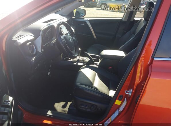 JTMDFREV9GJ073803 2016 TOYOTA RAV4 Orange Widok wnętrza z przodu