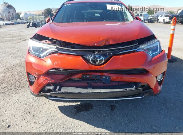 JTMDFREV9GJ073803 2016 TOYOTA RAV4 Orange Widok z przodu