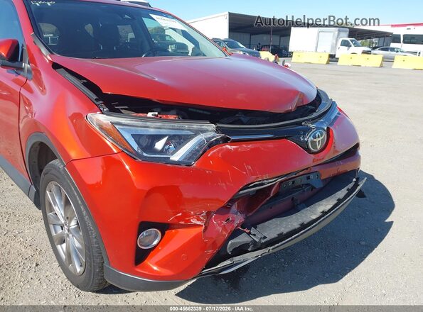 JTMDFREV9GJ073803 2016 TOYOTA RAV4 Orange Widok wnętrza z tyłu