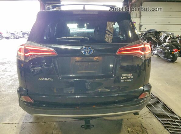 JTMDJREV0JD185779 2018 TOYOTA RAV4 Black Rear view