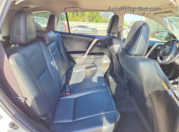 JTMDJREV6GD038844 2016 TOYOTA RAV4 White Rear seats view