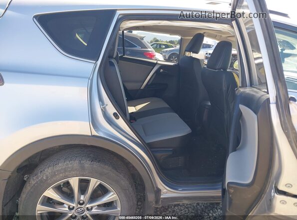 JTMDJREV6JD208174 2018 TOYOTA RAV4 HYBRID Silver Vista de la etiqueta del VIN