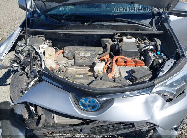 JTMDJREV6JD208174 2018 TOYOTA RAV4 HYBRID Silver Vista trasera