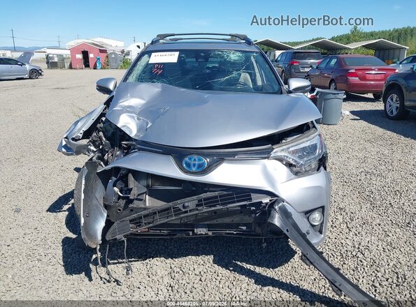 JTMDJREV6JD208174 2018 TOYOTA RAV4 HYBRID Silver Vista interior trasera