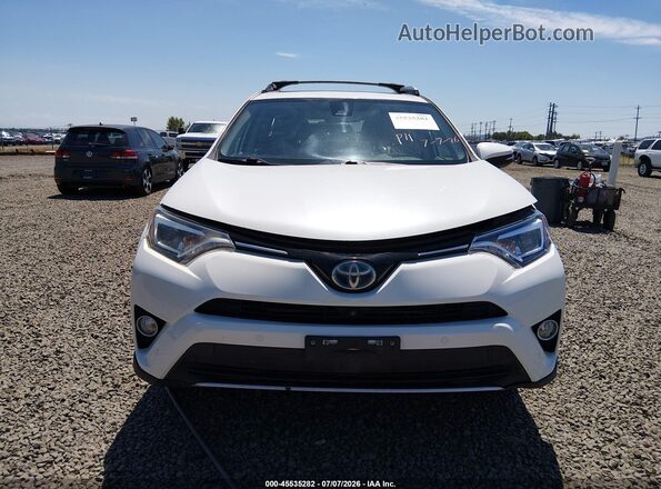 JTMDJREV7GD040005 2016 TOYOTA RAV4 HYBRID White Вид задньої частини салону