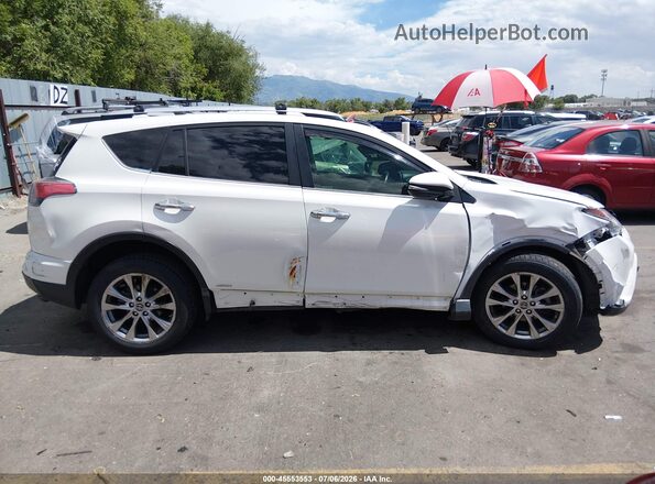 JTMDJREVXGD040421 2016 TOYOTA RAV4 HYBRID White Rear interior view