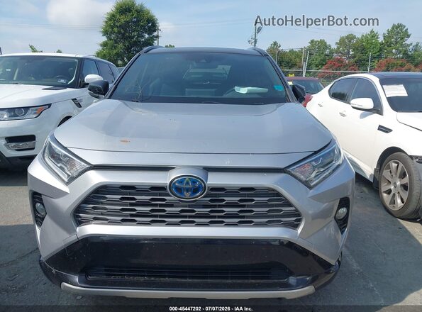 JTMEWRFV0LJ045255 2020 TOYOTA RAV4 HYBRID Серебряный Вид задней части салона